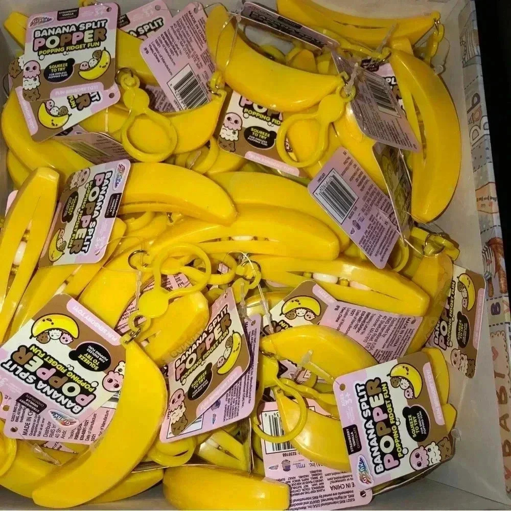 NEW with tags popper fidget toy keychain clip - banana  
Box Of 50